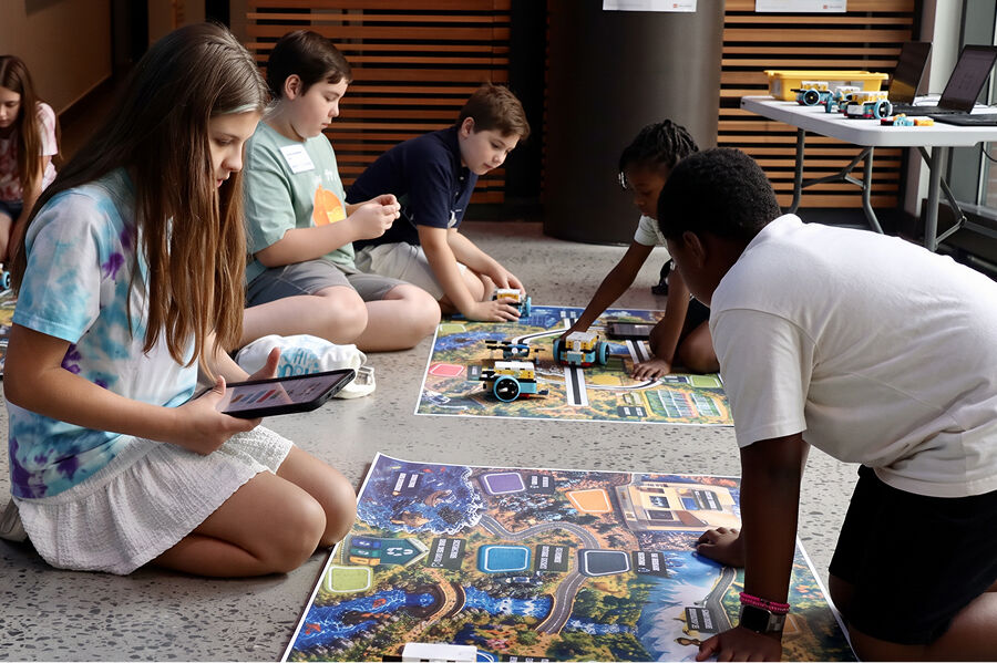 Students modeling smart-city systems with robots