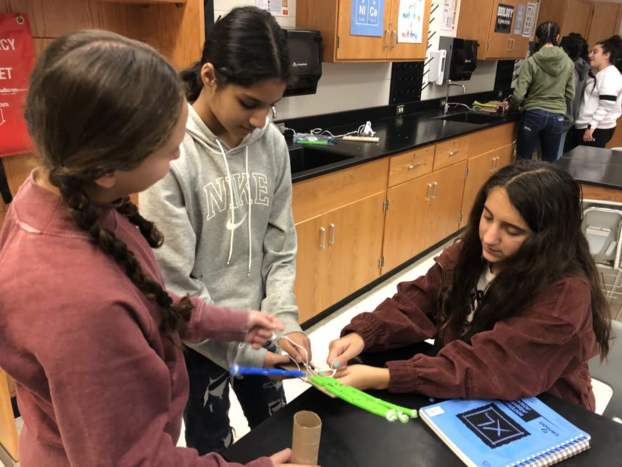 Students building a project in a school lab