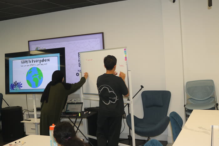 Students working through a community STEM session